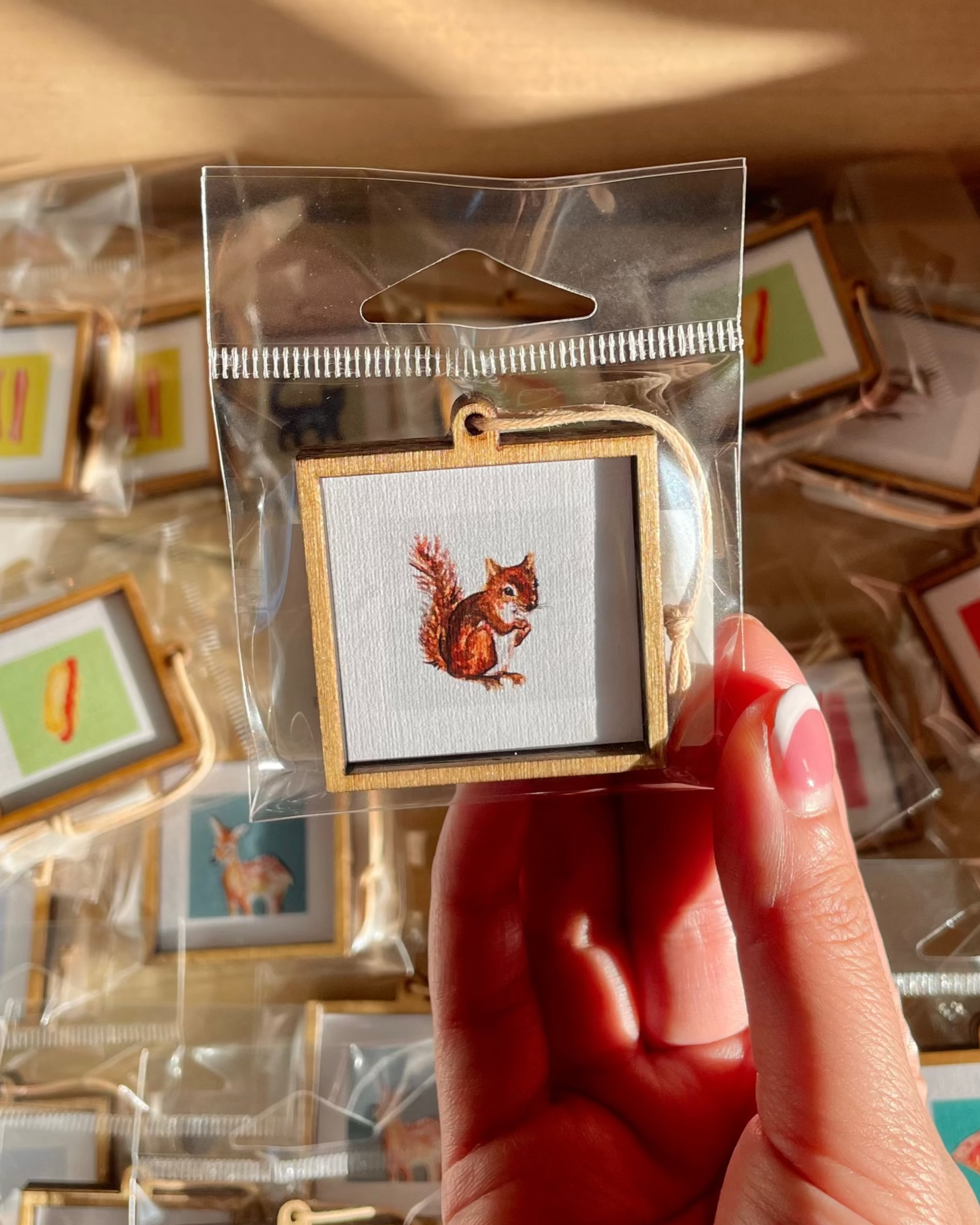 mini watercolor painting of a squirrel