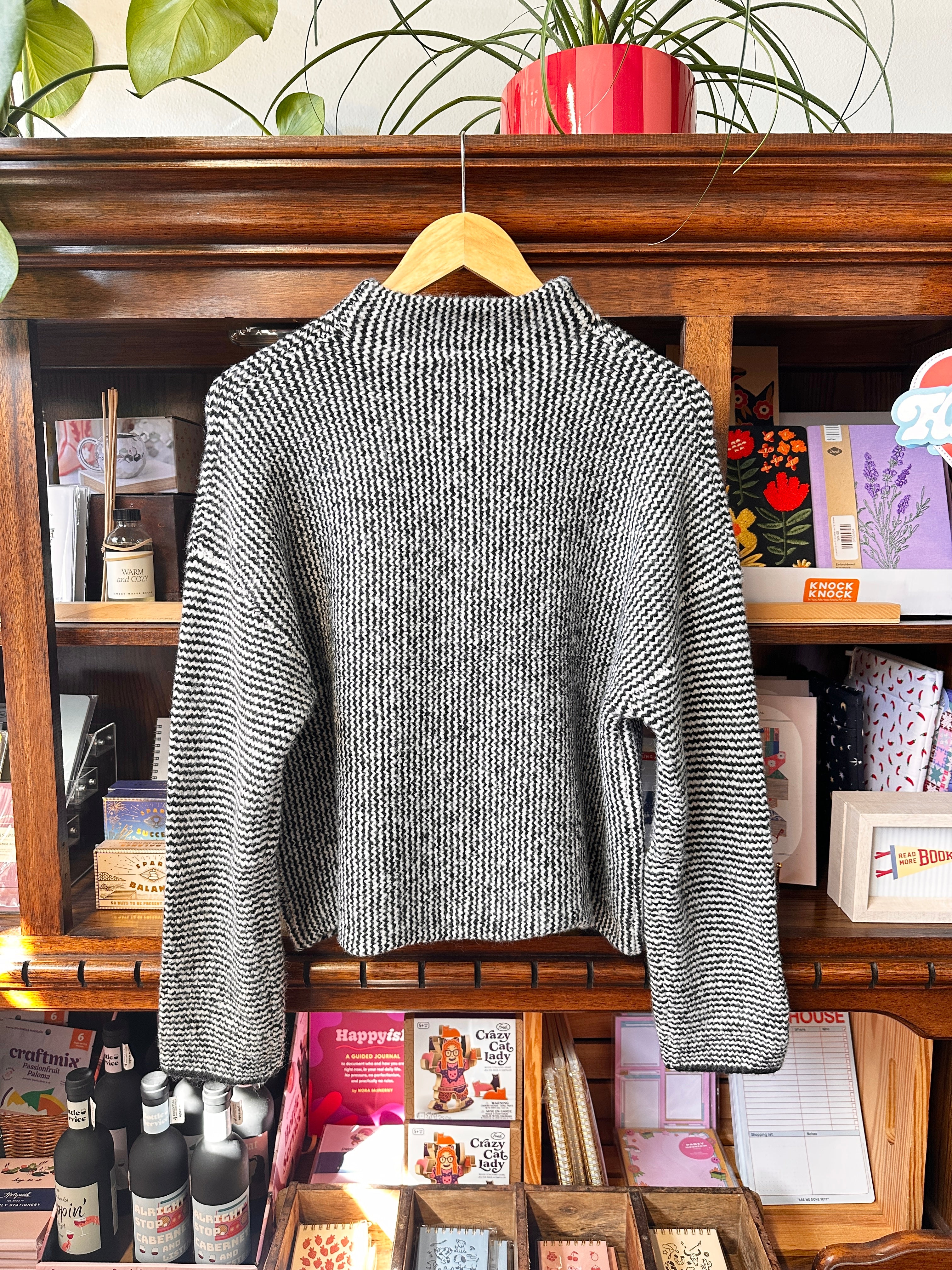 the back of a black and white striped sweater.